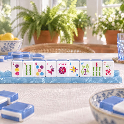 Cornflower Ladybug American Mahjong Set, tiles on a rack, seen from across the table